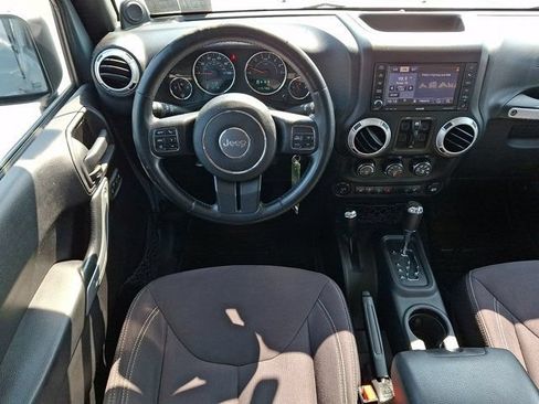 Used 2014 Jeep Wrangler Unlimited Sahara w/ Dual Top Group AWD/4WD image 16
