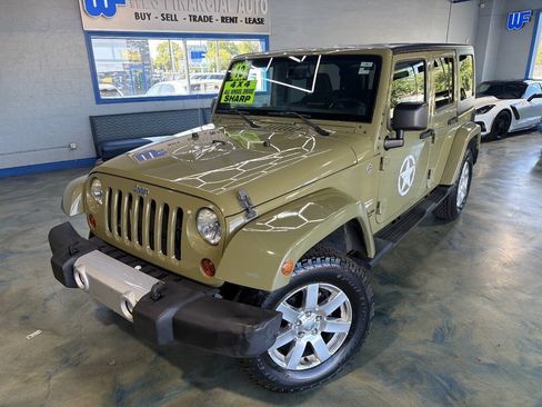 Used 2013 Jeep Wrangler Unlimited Sahara w/ Dual Top Group AWD/4WD image 1