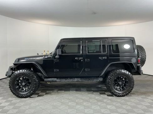 Used 2012 Jeep Wrangler Unlimited Rubicon w/ Dual Top Group AWD/4WD image 8