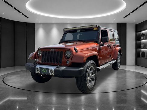 Used 2014 Jeep Wrangler Unlimited Sahara w/ Dual Top Group AWD/4WD image 1