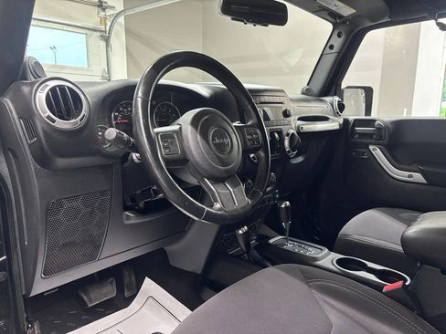 Used 2013 Jeep Wrangler Unlimited Sahara w/ Dual Top Group AWD/4WD image 13