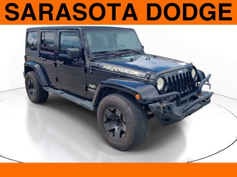 Used 2014 Jeep Wrangler Unlimited Sahara w/ Dual Top Group AWD/4WD image 1