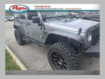 Used 2013 Jeep Wrangler Unlimited Sport w/ Mopar Black Appearance Group