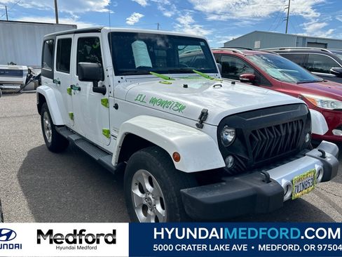 Used 2015 Jeep Wrangler Unlimited Sahara AWD/4WD image 1