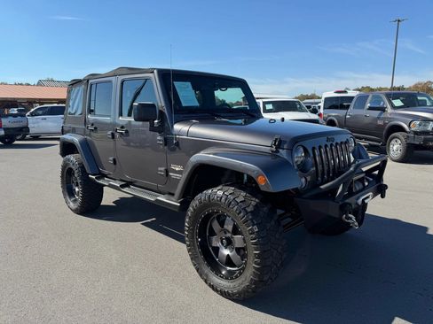Used 2014 Jeep Wrangler Unlimited Sahara w/ Dual Top Group AWD/4WD image 1