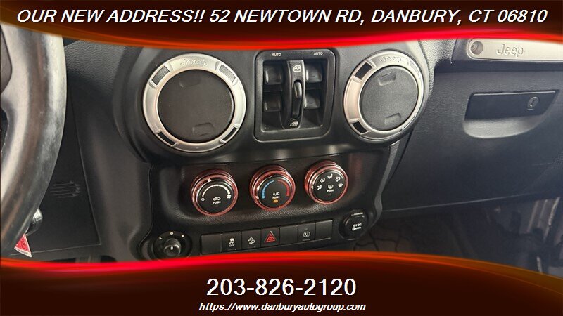 Used 2014 Jeep Wrangler Unlimited Sahara w/ Dual Top Group AWD/4WD image 16