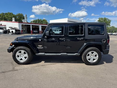 Used 2012 Jeep Wrangler Unlimited Sahara w/ Dual Top Group AWD/4WD image 2