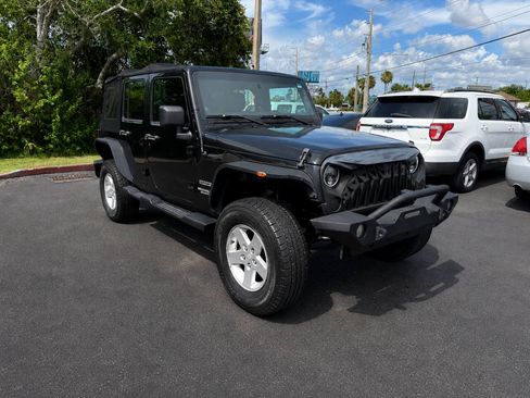 Used 2012 Jeep Wrangler Unlimited Sport w/ Connectivity Group AWD/4WD image 2