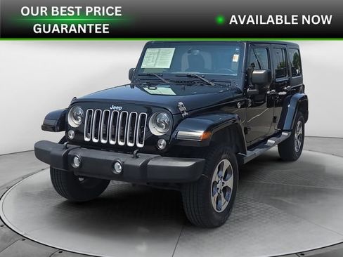 Used 2016 Jeep Wrangler Unlimited Sahara w/ Dual Top Group AWD/4WD image 1