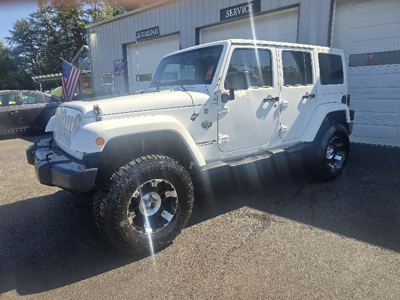 Used 2012 Jeep Wrangler Unlimited Sahara AWD/4WD image 1