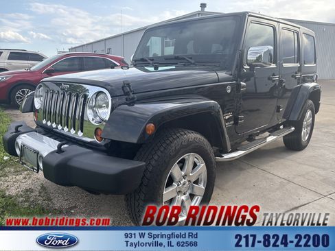 Used 2012 Jeep Wrangler Unlimited Sahara w/ Dual Top Group AWD/4WD image 1