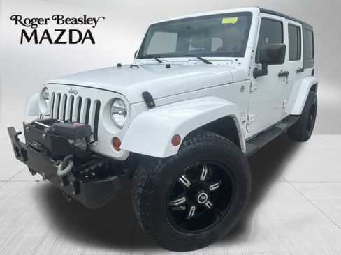 Used 2013 Jeep Wrangler Unlimited Sahara AWD/4WD image 1