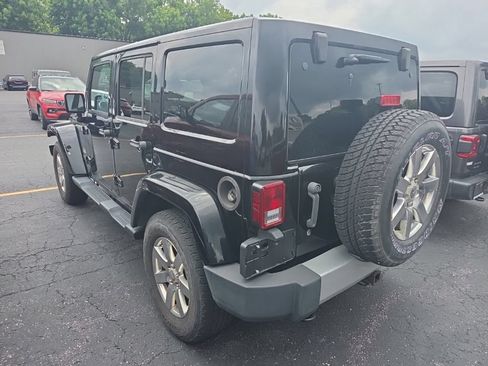 Used 2013 Jeep Wrangler Unlimited Sahara w/ Dual Top Group AWD/4WD image 2