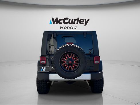 Used 2012 Jeep Wrangler Unlimited Sport w/ Black Appearance Group AWD/4WD image 4