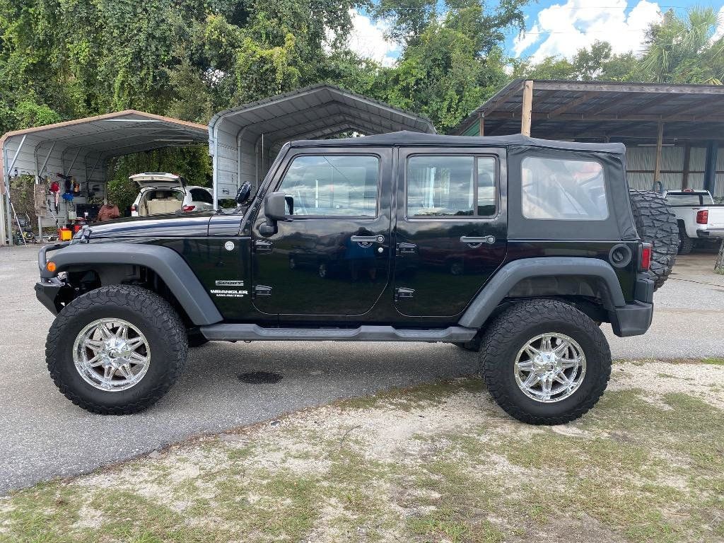 Used 2011 Jeep Wrangler Unlimited Sport w/ Connectivity Group AWD/4WD image 1