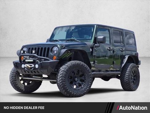 Used 2011 Jeep Wrangler Unlimited Sahara w/ Trailer Tow Group AWD/4WD image 1