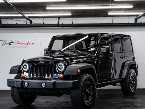 Used 2012 Jeep Wrangler Unlimited Rubicon w/ Dual Top Group AWD/4WD image 1