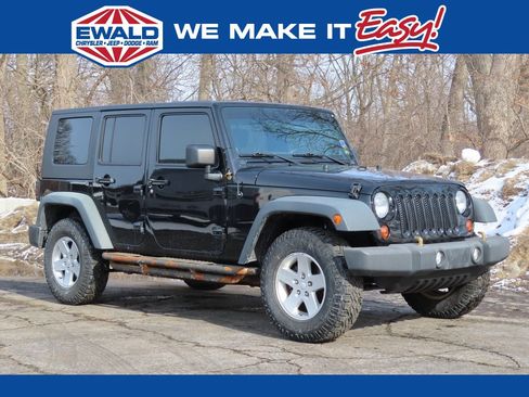 Used 2010 Jeep Wrangler Unlimited Sport image 1
