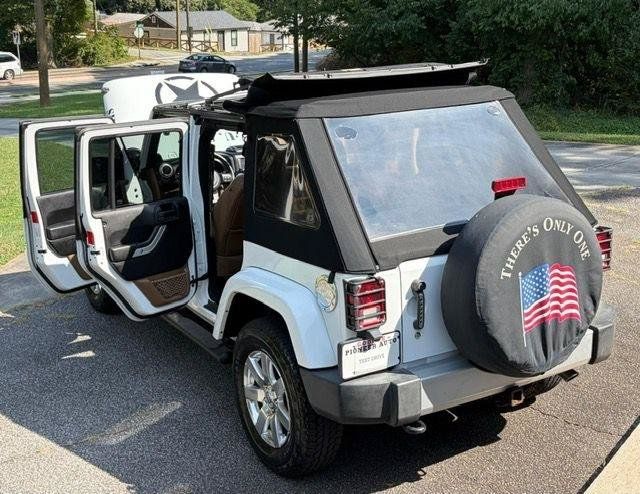 Used 2013 Jeep Wrangler Unlimited Sahara w/ Dual Top Group AWD/4WD image 36