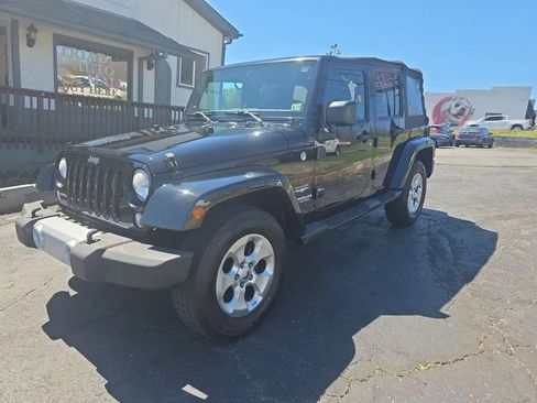 Used 2014 Jeep Wrangler Unlimited Sahara w/ Max Tow Package AWD/4WD image 1