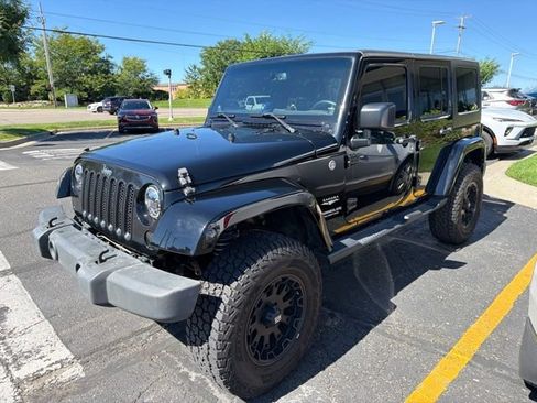 Used 2013 Jeep Wrangler Unlimited Sahara w/ Dual Top Group AWD/4WD image 2