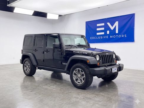 Used 2014 Jeep Wrangler Unlimited Rubicon w/ Dual Top Group AWD/4WD image 1
