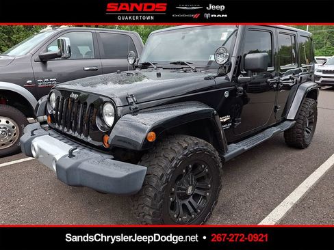 Used 2012 Jeep Wrangler Unlimited Sahara w/ Dual Top Group AWD/4WD image 1