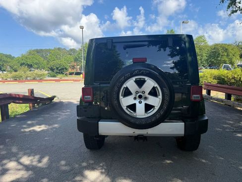 Used 2012 Jeep Wrangler Unlimited Sahara w/ Dual Top Group AWD/4WD image 8