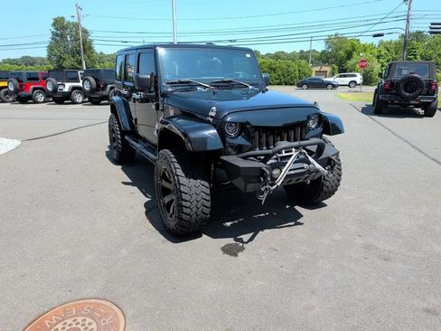 Used 2012 Jeep Wrangler Unlimited Sahara w/ Dual Top Group AWD/4WD image 12