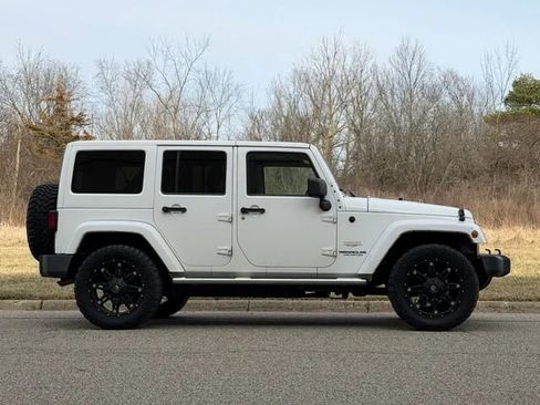 Used 2013 Jeep Wrangler Unlimited Sahara w/ Dual Top Group AWD/4WD image 24
