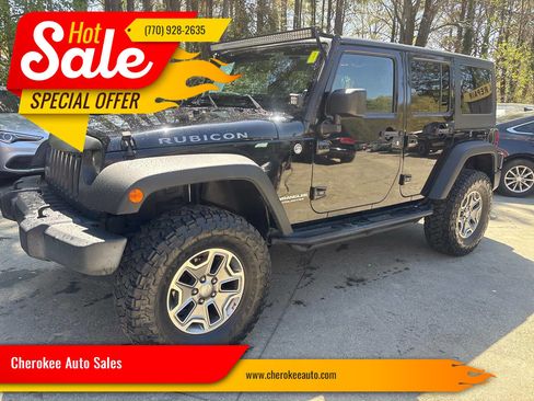 Used 2014 Jeep Wrangler Unlimited Rubicon w/ Dual Top Group image 1