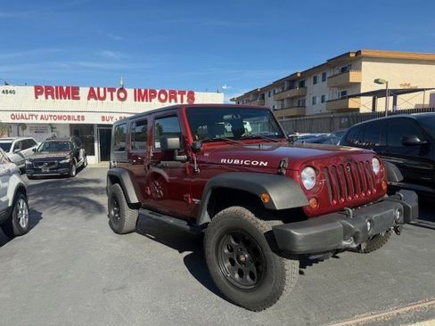 Used 2010 Jeep Wrangler Unlimited Rubicon w/ Dual Top Group image 1