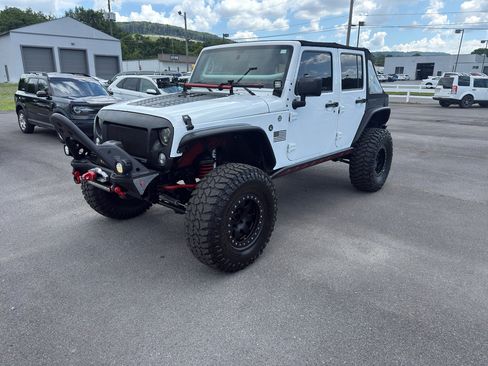 Used 2015 Jeep Wrangler Unlimited Sahara w/ Dual Top Group AWD/4WD image 1