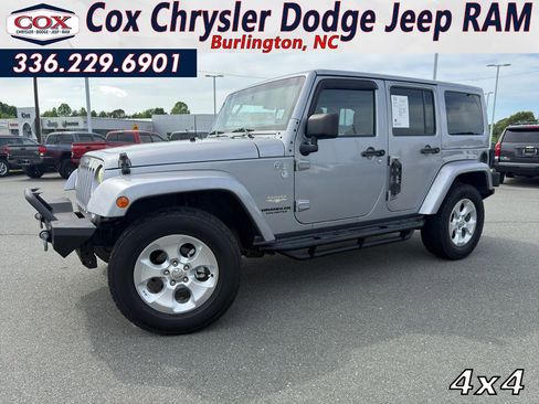 Used 2014 Jeep Wrangler Unlimited Sahara w/ Dual Top Group AWD/4WD image 1