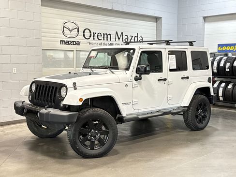 Used 2014 Jeep Wrangler Unlimited Sahara AWD/4WD image 1