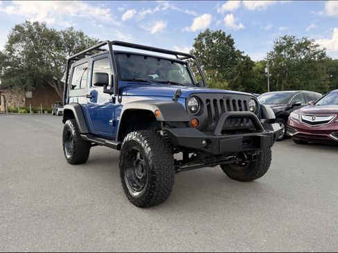 Used 2009 Jeep Wrangler Sahara w/ Dual Top Group AWD/4WD image 1
