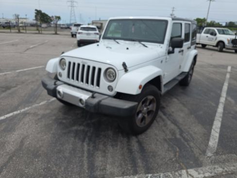 Used 2016 Jeep Wrangler Unlimited Sahara w/ Dual Top Group AWD/4WD image 1