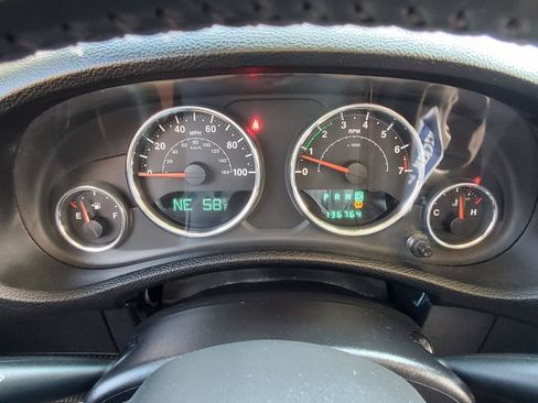 Used 2012 Jeep Wrangler Unlimited Sahara w/ Dual Top Group AWD/4WD image 9