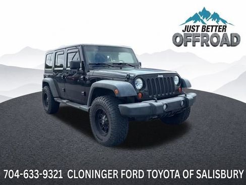 Used 2011 Jeep Wrangler Unlimited Sport AWD/4WD image 1
