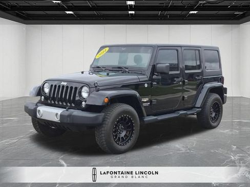 Used 2014 Jeep Wrangler Unlimited Sahara AWD/4WD image 1