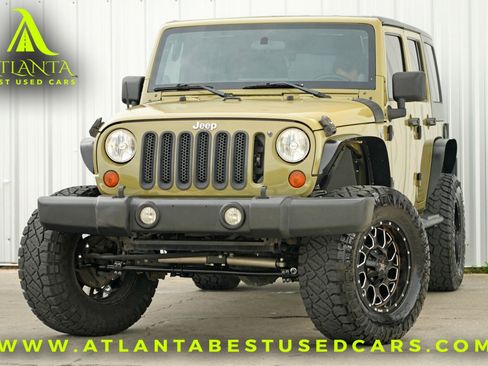 Used 2013 Jeep Wrangler Unlimited Sport w/ Mopar Black Appearance Group image 1