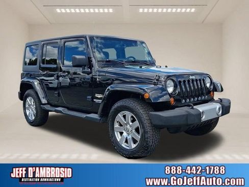Used 2013 Jeep Wrangler Unlimited Sahara w/ Trailer Tow Group AWD/4WD image 1