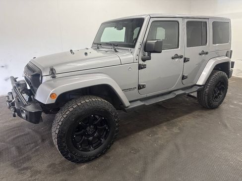 Used 2015 Jeep Wrangler Unlimited Sahara w/ Dual Top Group AWD/4WD image 1