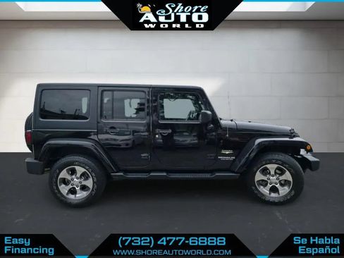 Used 2014 Jeep Wrangler Unlimited Sahara w/ Dual Top Group AWD/4WD image 4