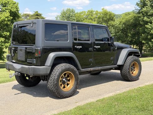 Used 2014 Jeep Wrangler Unlimited Rubicon w/ Dual Top Group AWD/4WD image 9