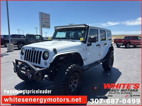 Used 2014 Jeep Wrangler Unlimited Sahara AWD/4WD image 1