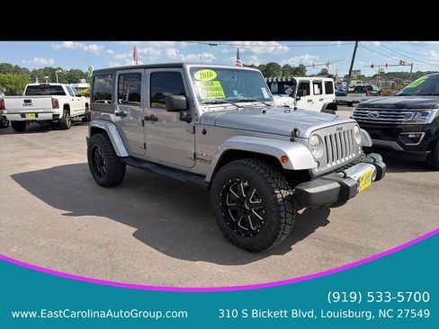Used 2016 Jeep Wrangler Unlimited Sahara w/ Dual Top Group AWD/4WD image 1