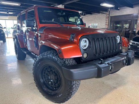 Used 2014 Jeep Wrangler Unlimited Sahara w/ Dual Top Group AWD/4WD image 1