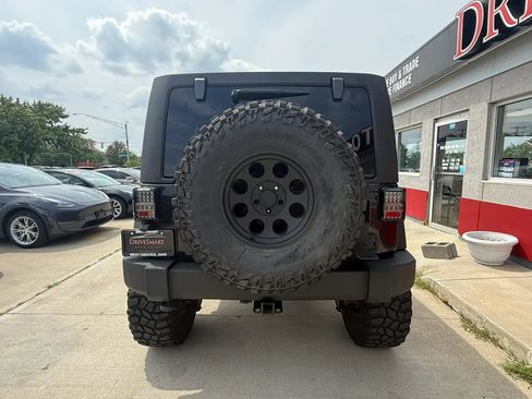 Used 2014 Jeep Wrangler Unlimited Rubicon w/ Dual Top Group AWD/4WD image 8