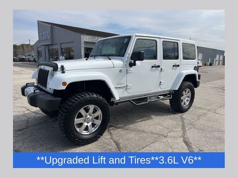 Used 2013 Jeep Wrangler Unlimited Sahara w/ Dual Top Group AWD/4WD image 1